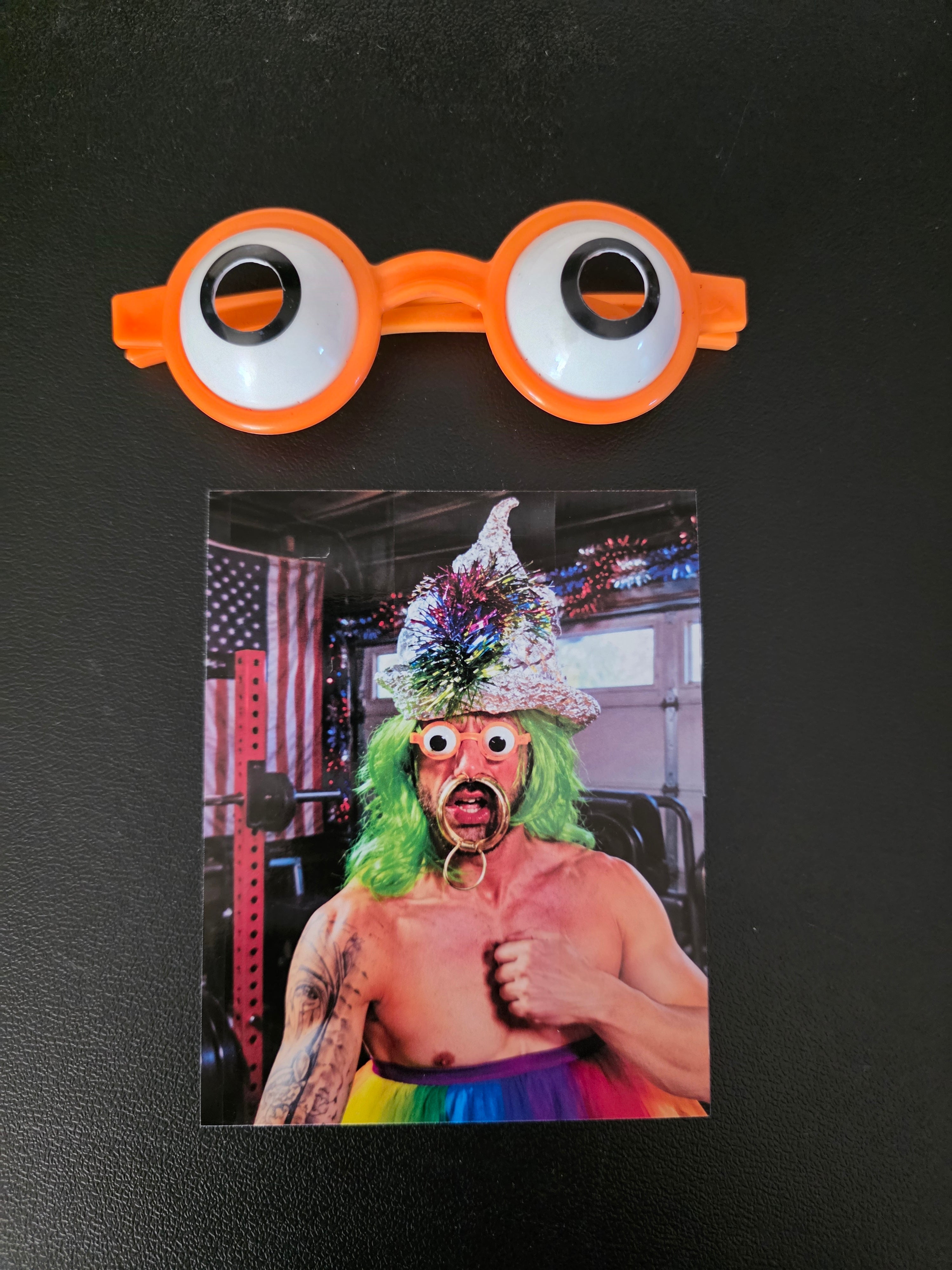 ORANGE GOOGLY EYE GLASSES AND PICTURE OF PATRIOTIC BRANDON